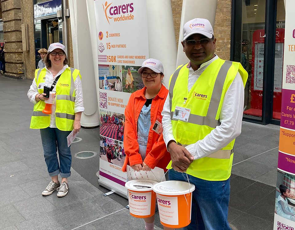 Carers fundraising outside with buckets