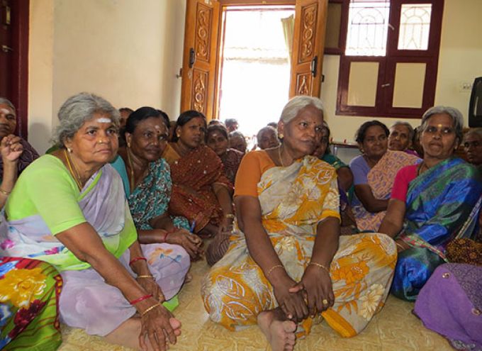 Ladies from India sitting on the floor