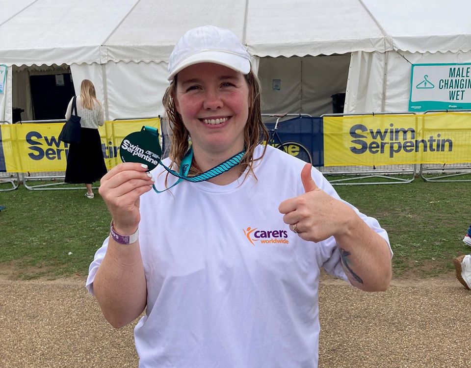 women wins at charity event show medal