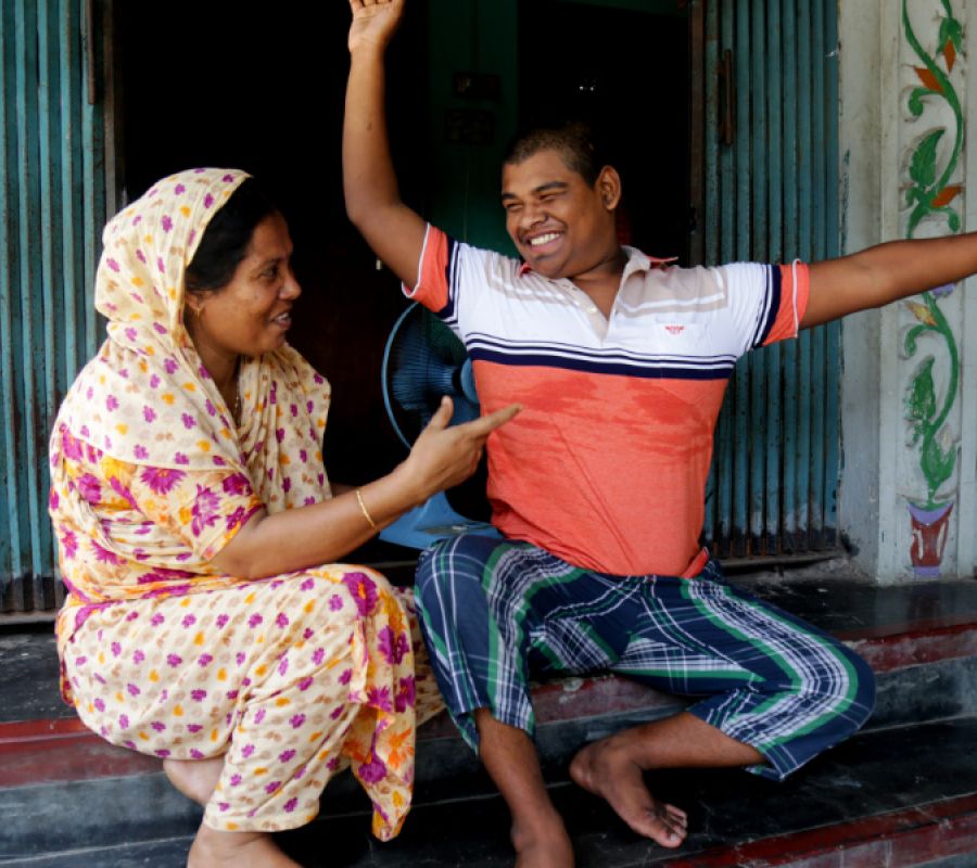 A carer monther and her son laughing 