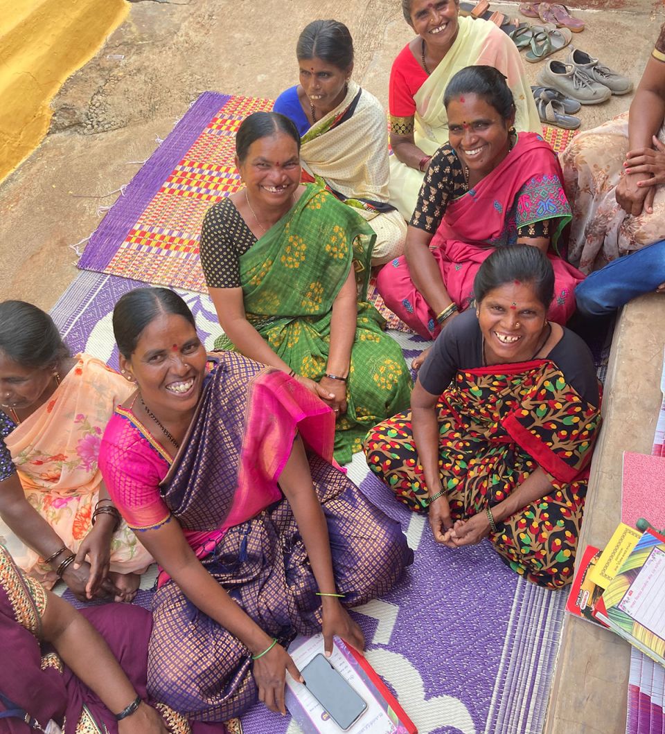 a group of women look up at camera