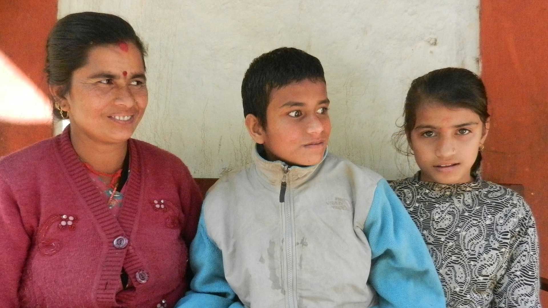 Female carer with her son and daughter in Nepal